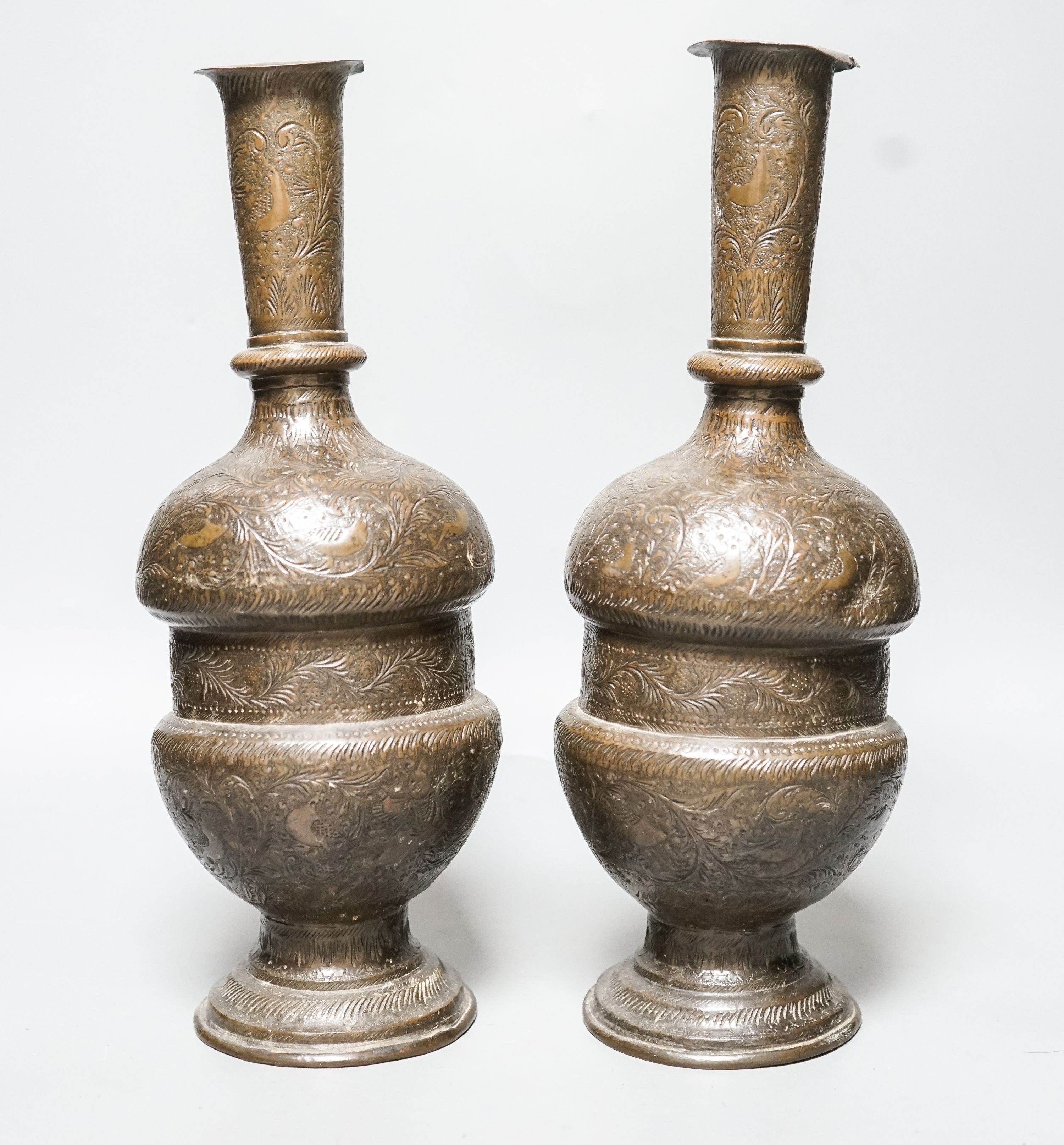 A pair of Persian engraved vases 32cm
